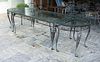 A Salterini Wrought Iron Glass Top Dining Table for Twelve
Height 29 3/4 x length 124 1/2 x depth 40 1/4 inches.