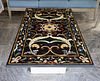 An Italian Pietra Dura Table Top
60 x 35 1/4 inches.