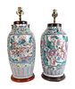 A Pair of Famille Rose Porcelain Vases Mounted as Lamps
Height excluding fittings 19  x diameter 9 inches.