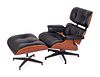 An Eames Laminated Walnut and Black Leather Lounge and Ottoman
Height 33 1/2 x width 32 x depth 32 inches; height of ottoman 17 x width 26 x depth 22 