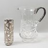 Jarra y vaso. Siglo XX. Diferentes diseños. Elaborados en cristal con aplicaciones de metal plateado.