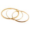 A Collection of Three Bangles in 14K Yellow Gold