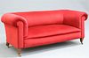 A HOWARD AND SONS RED VELVET UPHOLSTERED MAHOGANY SOFA, wit