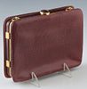 Vintage Judith Leiber Maroon Lizard Clutch, with dual compartments and gold tone hardware, with two cabachon amethyst snap closures, the first interio