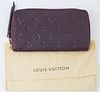 Louis Vuitton Dark Purple Monogram Empreinte Secret Wallet, the calf leather with golden accent zipper to leather pull, opening to two bill compartmen