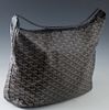 Goyard Fidji Black and Brown Leather Hobo Bag, with silver hardware, the interior of the bag lined in beige canvas, with a single black leather strap,