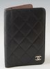Chanel Black Lambskin Small Agenda Case, c. 2009, with a silver CC logo on front, the interior lined in dark brown leather with three open storage slo