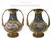 A PAIR OF CHAMPLEVE ENAMEL BRONZE & SEVRES VASES