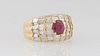 Lady's 14K Yellow Gold Dinner Ring, with an oval .82 ct. ruby flanked by graduated horizontal rows of three tapered baguette diamonds, atop a ribbed b