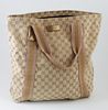 Gucci Beige and Gold Monogrammed Canvas Shopping Tote, with pink and gold striped canvas straps and gold leather accents, opening to a brown lined int