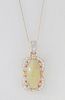 14K Yellow Gold Pendant, with a 5.92 ct. oval cabochon opal, within a curved frame of round diamonds, with a diamond mounted bail, on a tiny 14K white
