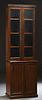English Carved Mahogany Slender Bookcase Cupboard, early 20th c., the stepped crown over a double glazed door bookcase, on a stepped base with double 