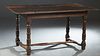 French Provincial Louis XIV Style Carved Oak Farmhouse Table, 18th c., the three board top over a wide skirt, on turned tapered and block legs joined 