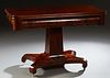 American Classical Carved Mahogany Dining Table, 19th c., the rounded corner fold over top over a wide skirt, on a tapered square support, to a quadru