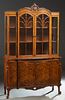 American English Style Carved Walnut Breakfront China Cabinet, 20th c., the double arched crown over double arched mullioned glazed doors, flanked by 