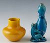 Two Chinese Earthenware Vases, 20th c., one in blue glaze of a monkey holding a gourd with a fly on it; the second a diminutive yellow baluster pot wi