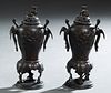 Pair of Chinese Bronze Censers, late 19th c., of tapering baluster form, with relief bird and bamboo decoration, the sides with bird handles, to tripo