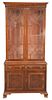 Two-Part Cabinet, with glass shelves, burlwood, on ogee feet, height 83 inches, width 38 inches.