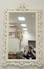 Chippendale Style Mirror, having white painted frame with carved scrolling vine and flowers, 50" x 30".