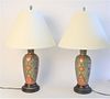 Pair of Porcelain Vases Turned into Lamps, and enameled in a Persian motif with jewel tones, height 25 inches.