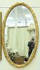 Pair Oval Gilt Mirrors, with foliate frames, 32" x 58".