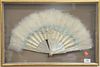 Ostrich Feather Fan, having mother of pearl, with painted scene in shadow box frame, width 20 inches.