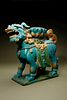 A Turquoise, Ochre and Green Glazed Tileworks 'Fu Lion' Stand