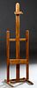 French Carved Beech Adjustable Artist's Easel, 19th c., on trestle supports, joined by square stretchers, H.- 68 in., W.- 20 in., D.- 20 in.