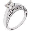RING WITH DIAMONDS IN 14K WHITE GOLD 1 Princess cut diamond ~0.75 ct, 60 Brilliant cut diamonds ~0.60 ct. Size: 7
