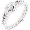 RING WITH DIAMONDS IN 14K WHITE GOLD 13 Brilliant cut diamonds ~0.40 ct. Weight: 3.2 g. Size: 5