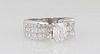 Lady's Platinum Dinner Ring, with a 1.52 ct. radiant cut diamond, flanked