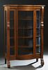 American Carved Oak Curved Glass Curio Cabinet, early 20th c., the bowfront top over a central curved glass door flanked by glass panels and curved gl