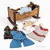 Black Cloth Doll, Group of Handmade Doll Clothes, and a Carved Doll Cradle