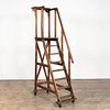 E. 20TH C. ROLLING WOODEN LIBRARY LADDER