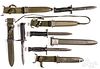 Four US bayonets with scabbards and frogs
