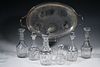 (6) CRYSTAL DECANTERS & (1) SILVER-PLATE TRAY