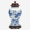 A Chinese blue and white porcelain vase with carved wood cover and stand The vase Kangxi period