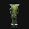 A small Chinese carved spinach green jade lobed gu-form vase