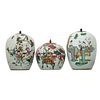 THREE CHINESE FAMILLE-ROSE ‘FIGURES’ JARS AND COVERS