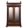 Armario.  Francia.  Siglo XX.  Estilo Enrique II.  En talla de madera de nogal.  Con 2 puertas abatibles, con espejo.