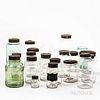 Twenty-four Blown Glass Cylindrical Storage Jars with Tin Lids