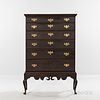 Brown-painted and Carved Cherry Chest-on-frame