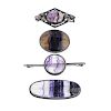 Four assorted Blue John brooches Comprising three oval, to include one cabochon within lozenge frame