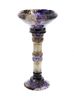 A Blue John pedestal cup The flared bowl, shading from clear to dark amethyst, with ribbed collar on
