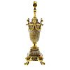 A Crich spar and ormolu lamp base The rounded cylindrical body with waisted neck over female masks,