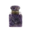 An amethyst ink bottle The hinged cover with flattened bun finial over engraved rim, the canted cubo