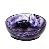 A small Blue John shallow bowl or dish. Of circular form with dark violet patches on a mottled lilac
