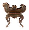 A Rococo Style Painted Sleigh-Form Jardiniere
Height 29 1/2 x length 27 x width 16 1/4 inches.