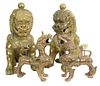 Two Pairs of Brass Foo Dogs to include a pair of large seated Chinese guardian lions, height 19 inches, along with a pair of standing foo lions, heigh