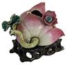 Chinese Lotus Flower Bud Pot, pink bud having worm eaton hole and green leaves on stand, pot height 2 1/4 inches. Provenance: The Estate of Diana Atwo